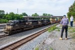 NS 1019 and 4586 pull a trash train by DeButts Yard 